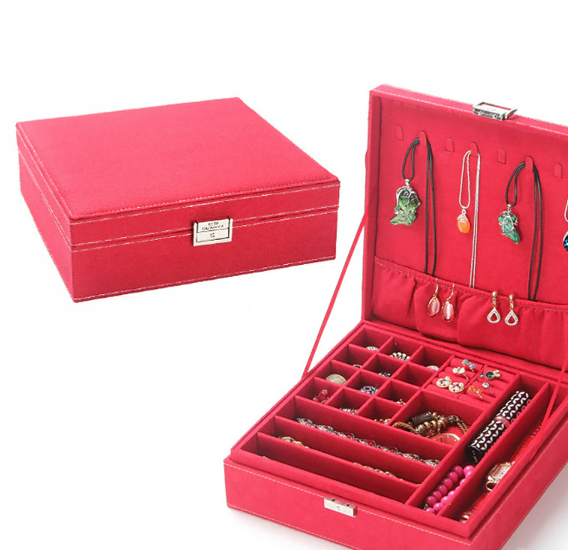 Open square velvet jewelry box with a ring in a compartment.