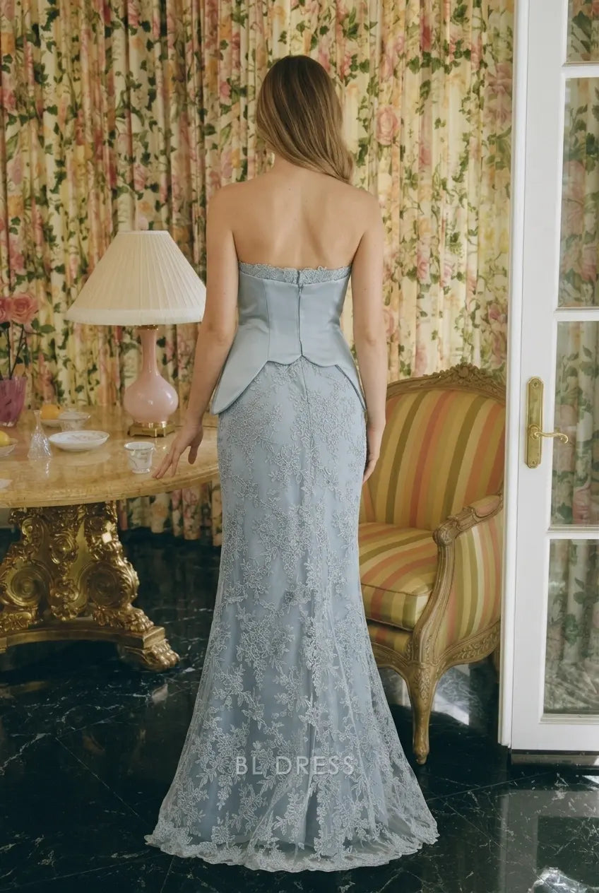 Back view of dusty blue lace mermaid gown, showing zipper and floor-length skirt.
