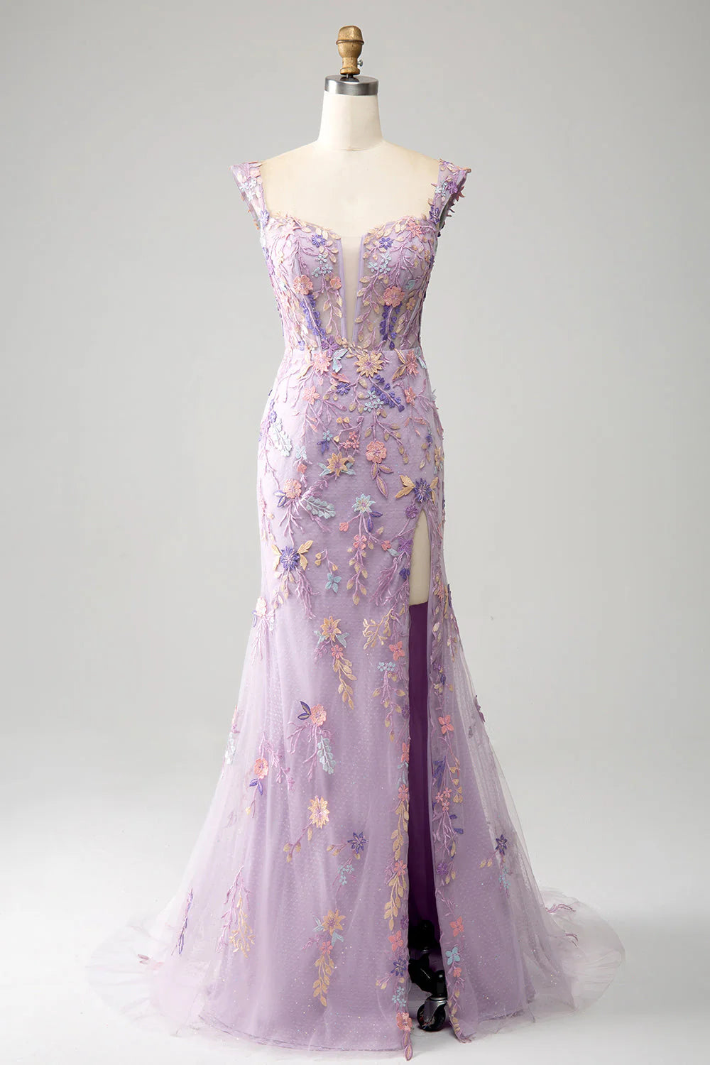 Model wearing an elegant mauve embroidered mermaid prom dress with an off-the-shoulder neckline and a high slit.