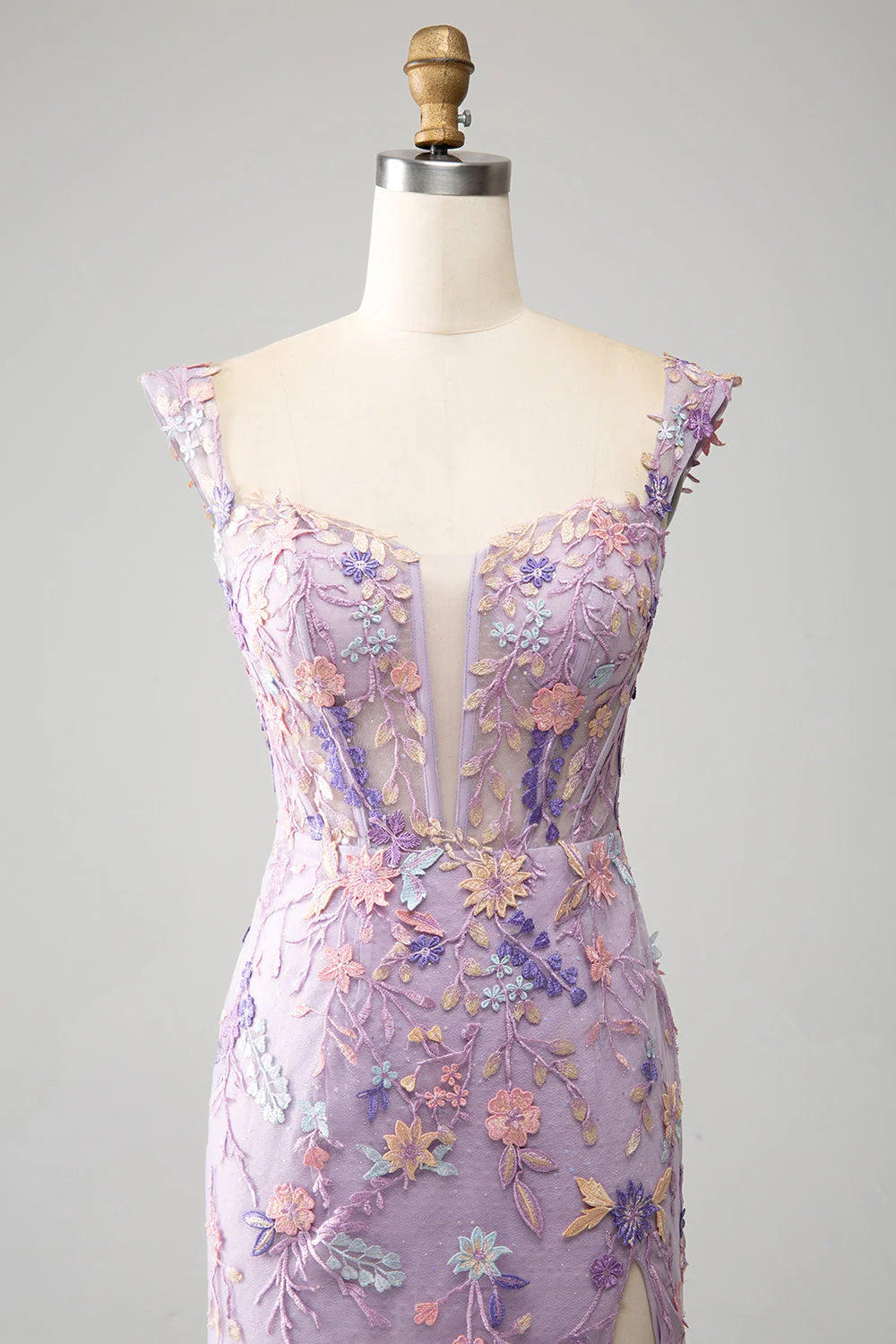 Close-up of the delicate embroidery on the bodice of the mauve mermaid prom dress.