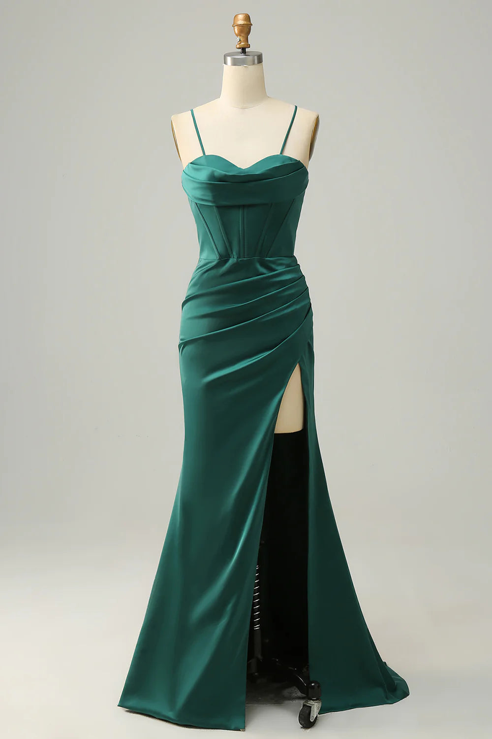 Elegant emerald green satin mermaid gown with spaghetti straps.