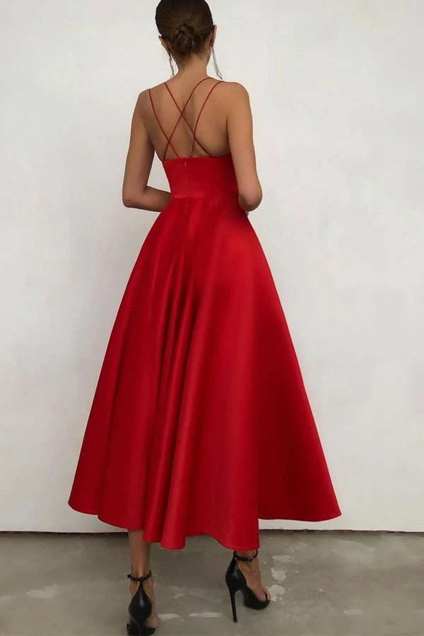 Side view of the sleeveless empire waist satin dress.
