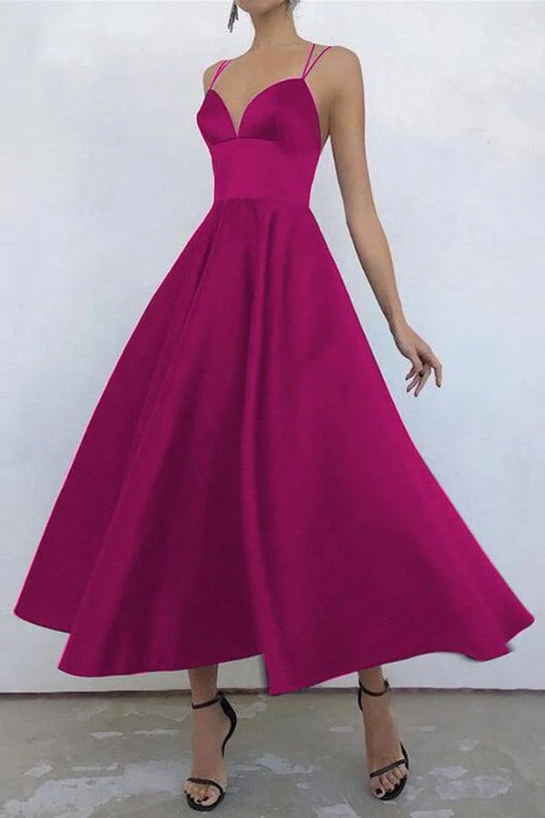Close-up of the satin fabric and V-neckline.