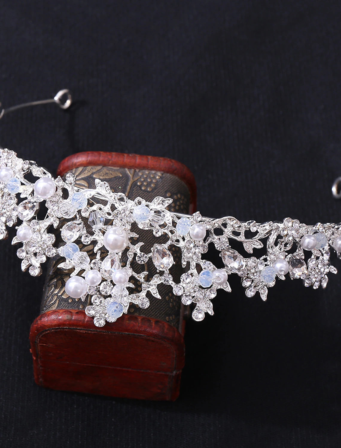 Close-up of faux pearls and crystal rhinestones on a bridal tiara.