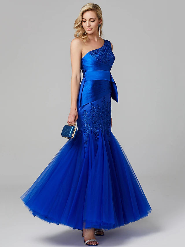 Back view of an elegant one-shoulder lace tulle formal dress.