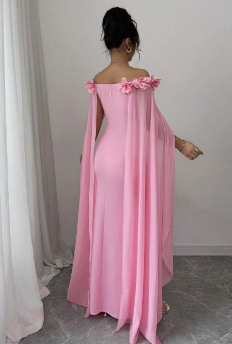 Back view of pink off-shoulder mermaid dress with floral details.