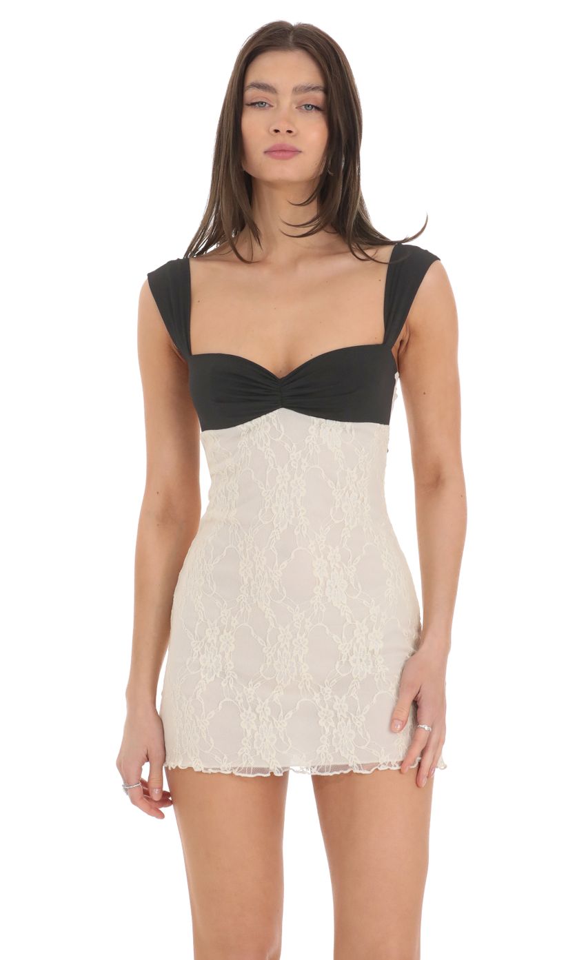 Front view of black and white lace homecoming dress with wide straps.