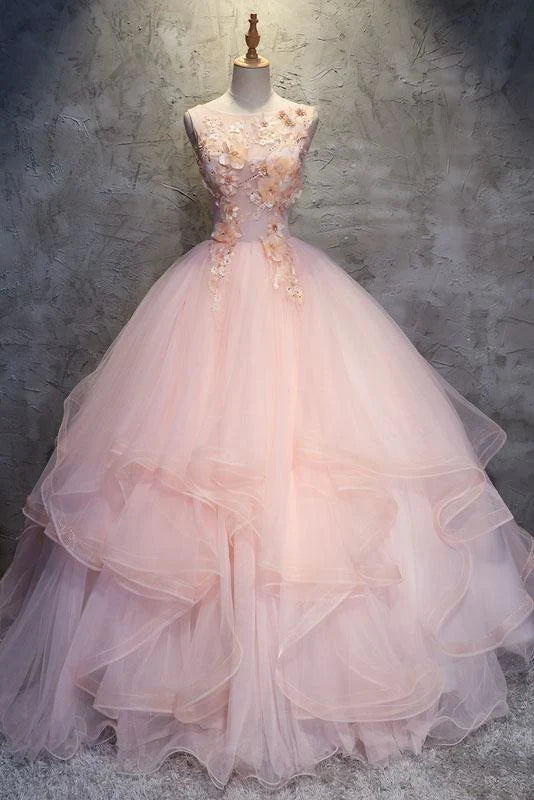 Woman wearing an elegant floral ball gown.