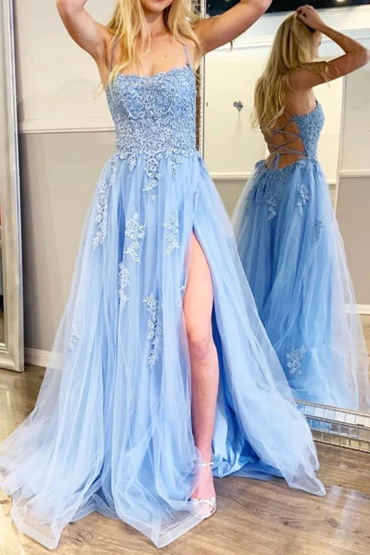 Close-up of floral lace detail on long formal dress.