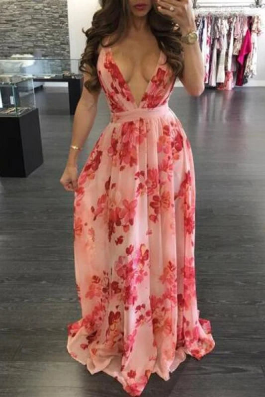 Woman wearing a floral print pleated V-neck backless maxi dress.