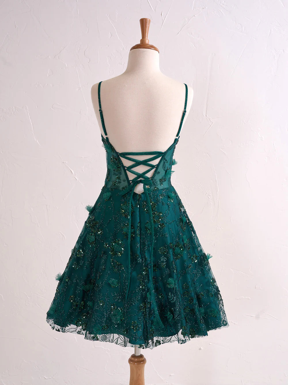 Full length view of a floral strapless sweetheart party dress.