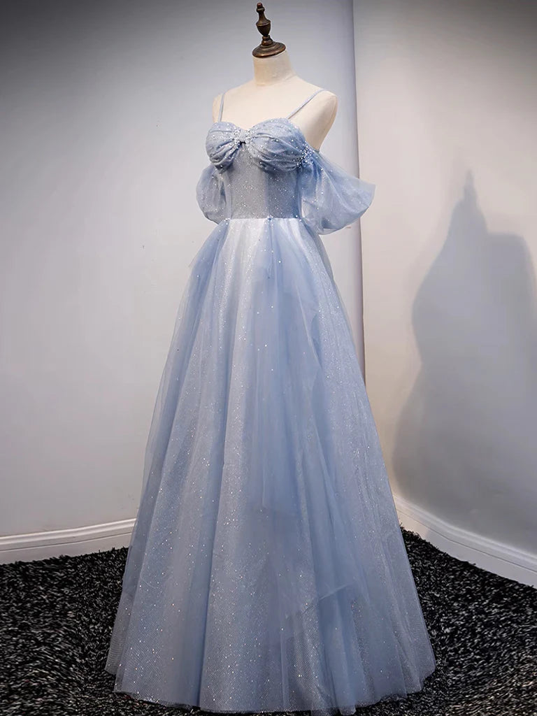 Back view of woman in elegant off-shoulder tulle gown.