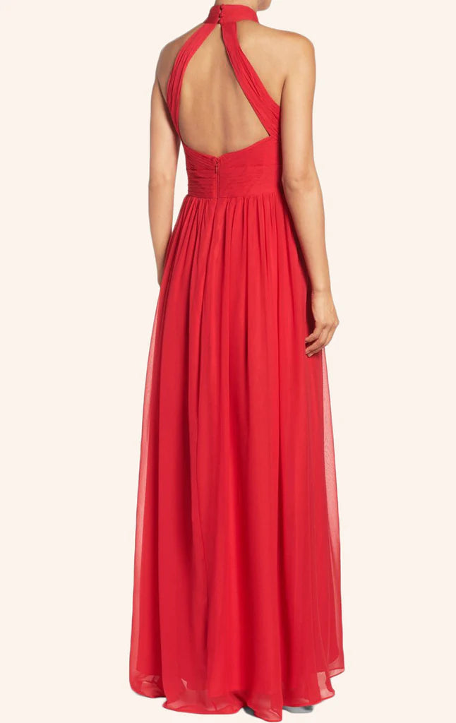 Back view of a woman in a flowing sleeveless formal chiffon gown.