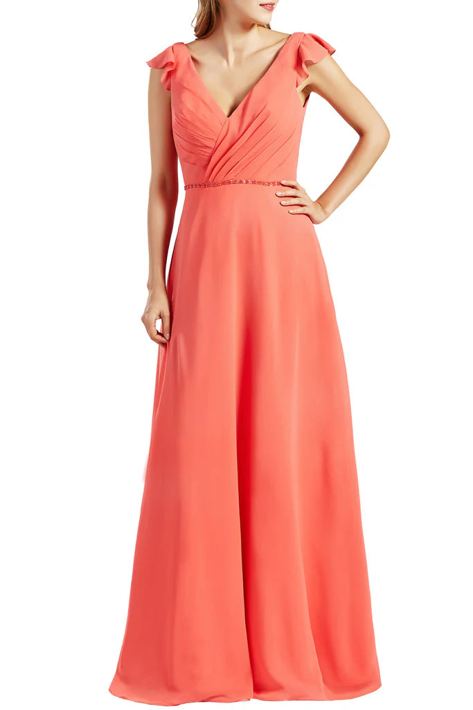 Woman wearing a long V-neck chiffon bridesmaid dress.