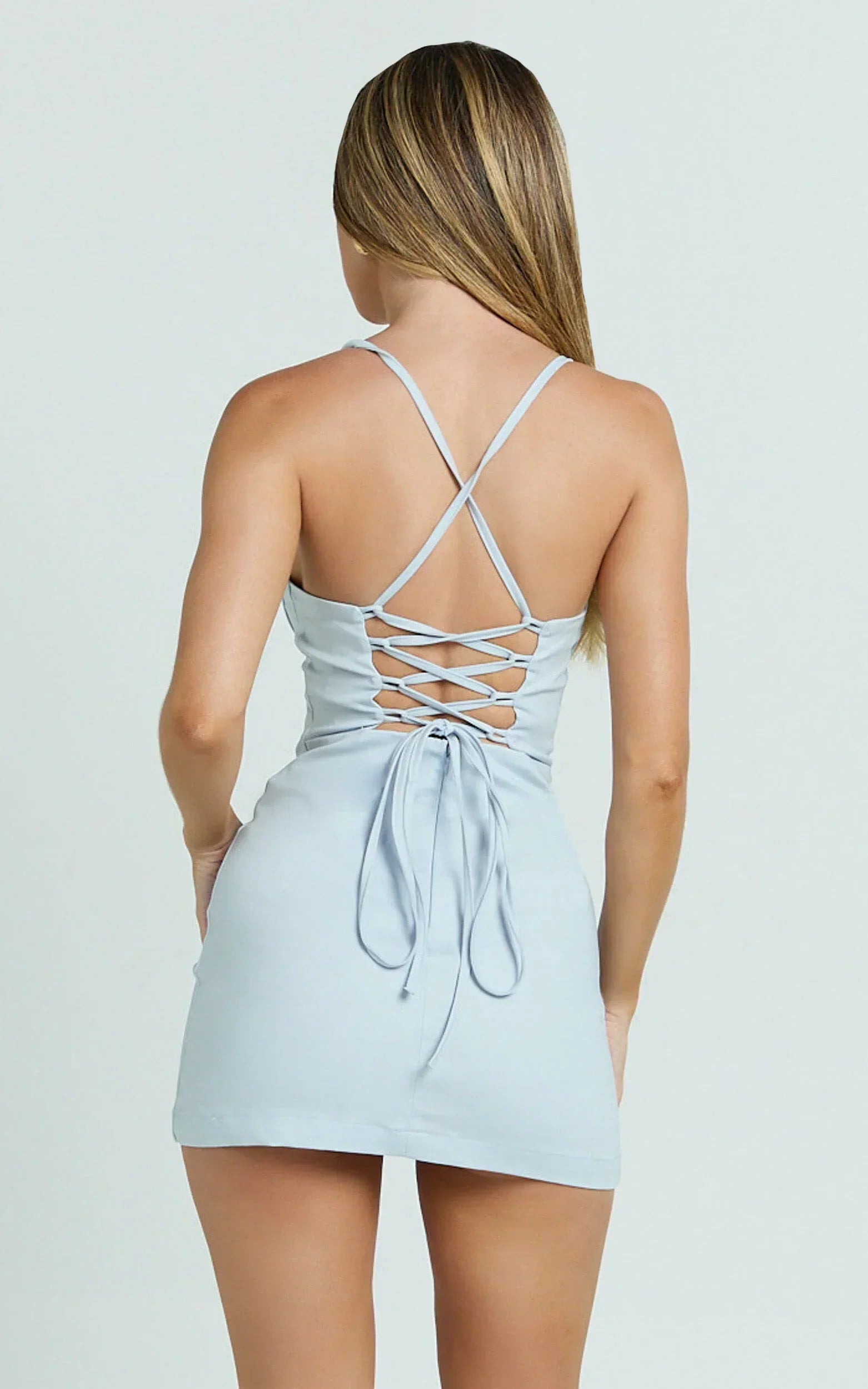 Side view of light blue form-fitting maxi dress.