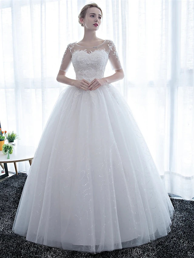 Elegant formal ball gown wedding dress with half sleeves and illusion neckline.