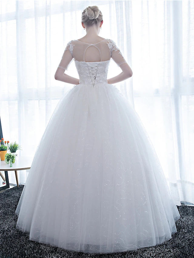 Back view of the floor-length lace satin wedding dress.
