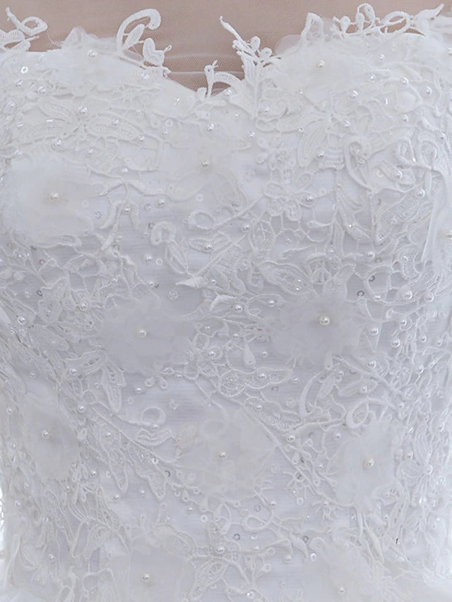 Side profile of the ball gown wedding dress, showcasing its silhouette.