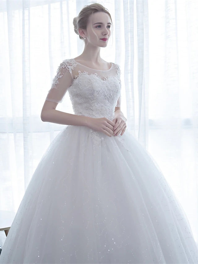 Detail of the illusion neckline and half sleeves on the formal dress.