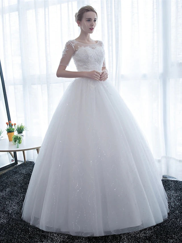 Close-up of the intricate lace details on the wedding dress.