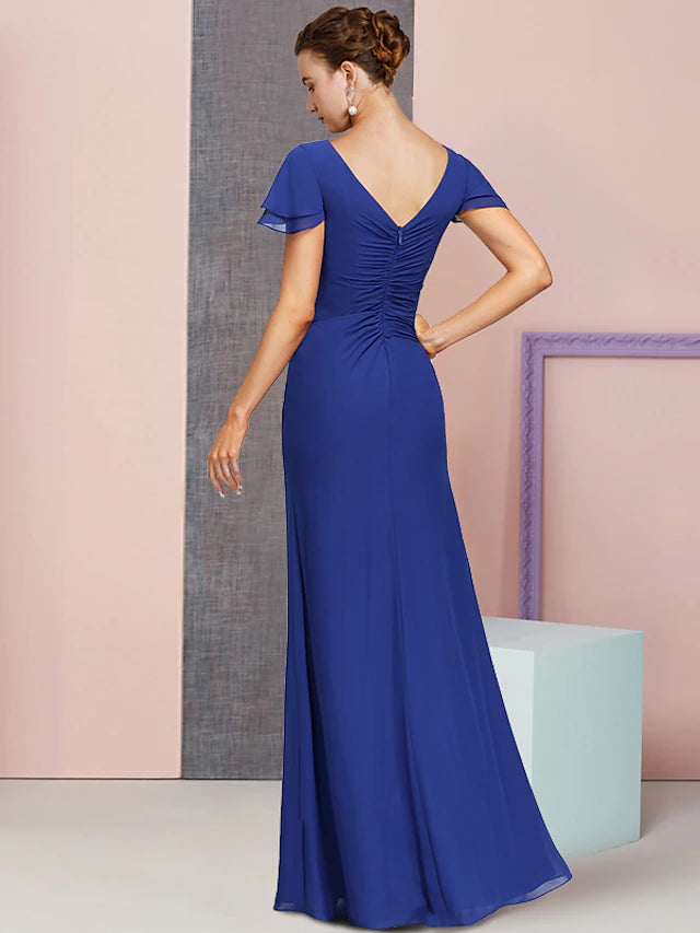 Side view of a flowing chiffon formal dress, showing the column silhouette.