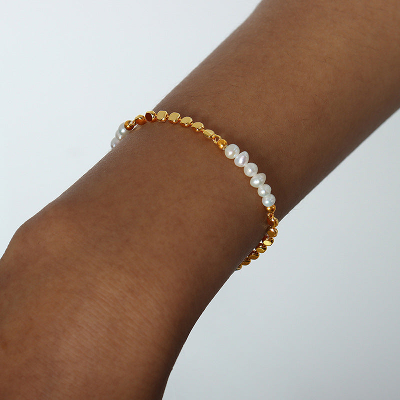 Fashionable copper bracelet featuring freshwater pearls.