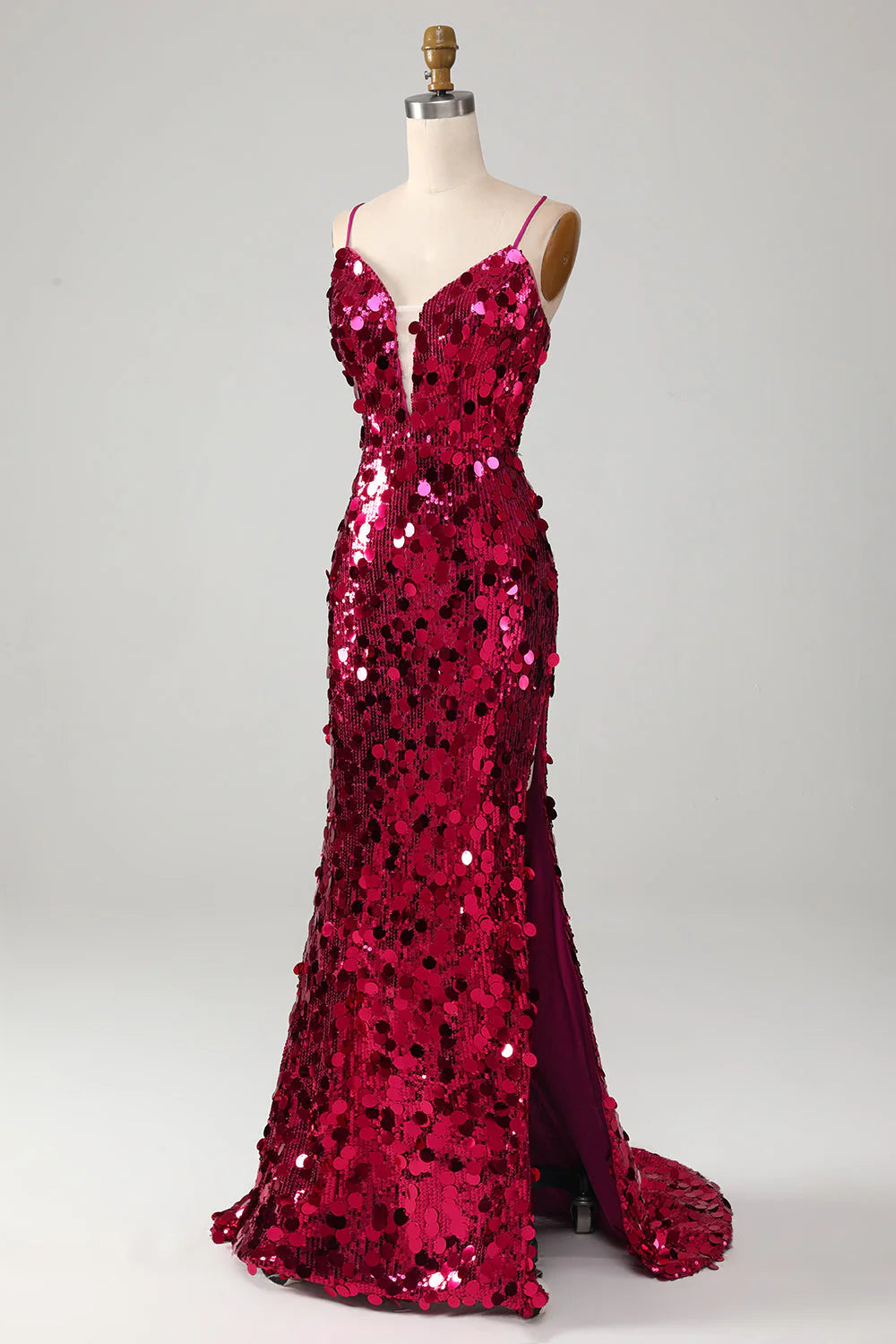 Back view of the fuchsia sequin mermaid gown, highlighting the flowing train and strap detail.