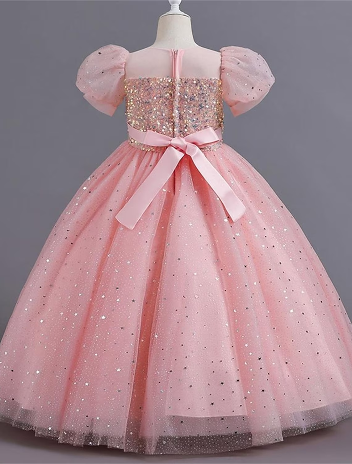 Close-up of the sequin bodice and short sleeves on the white princess dress.