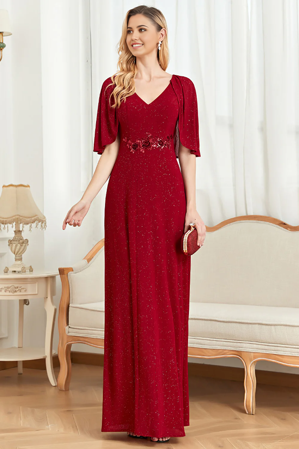 Back view of the glitter mother of the bride gown, showcasing the elegant cape.