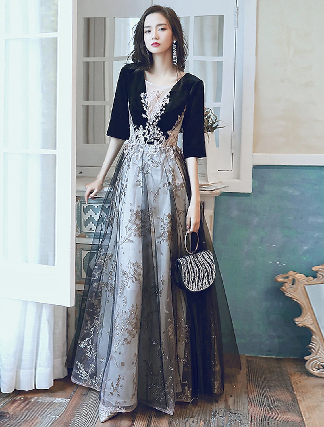 Elegant A-line velvet evening dress with illusion neck and half sleeves.