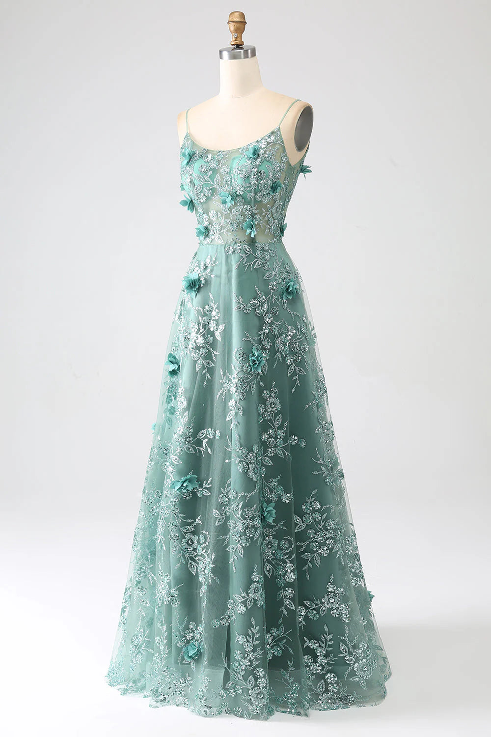 Side view of the floral lace details on the long prom dress.