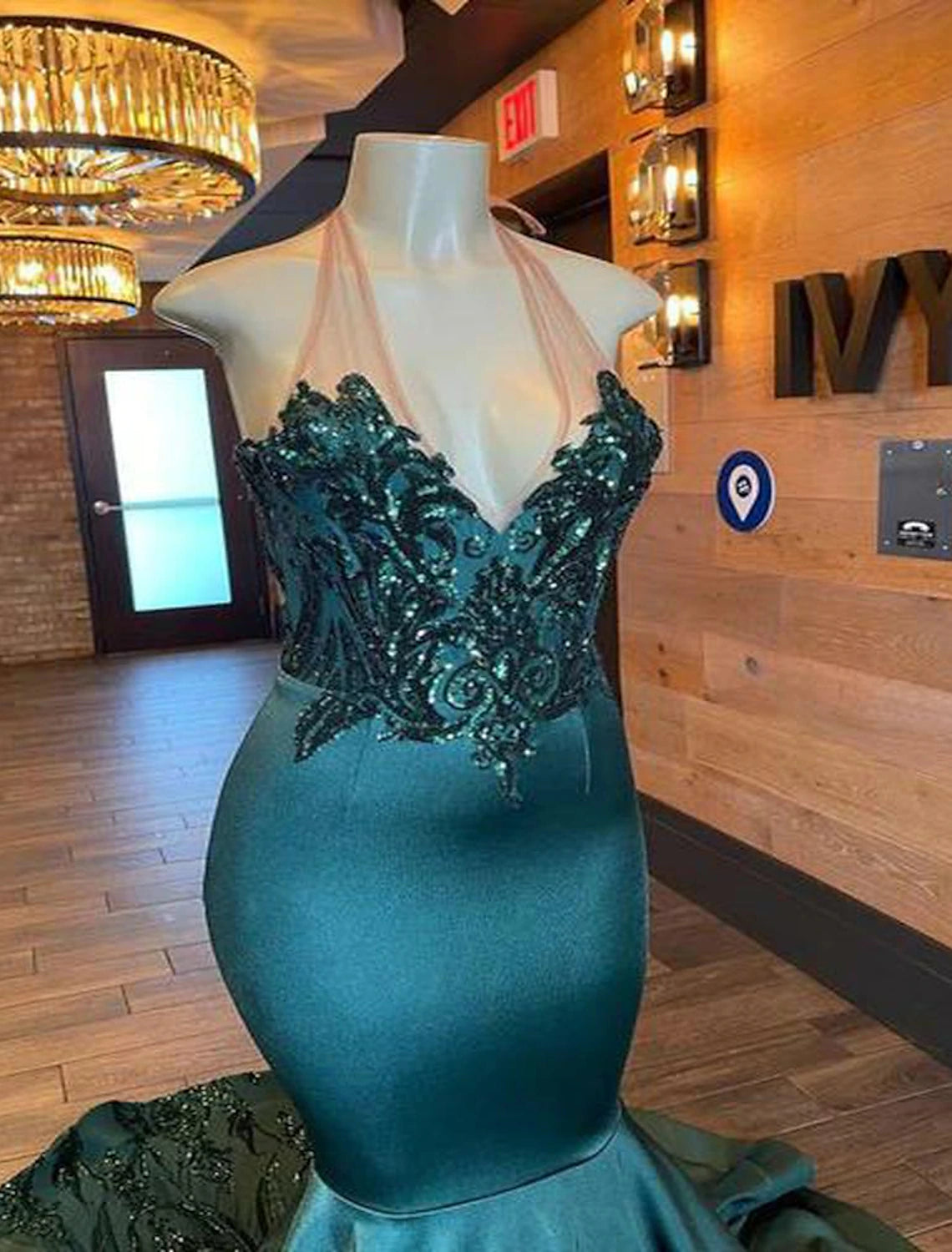 Backless V-neck formal gown with court train.