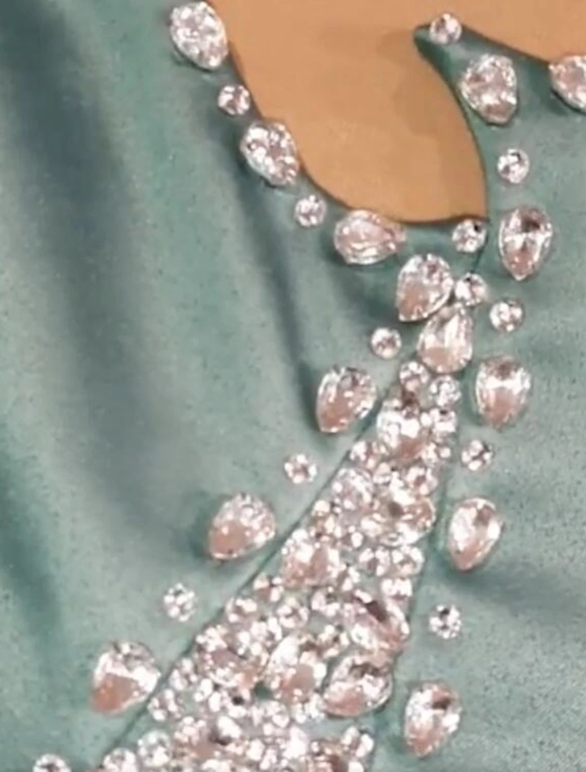 Side view of the formal sheath dress, showcasing its sweep train.