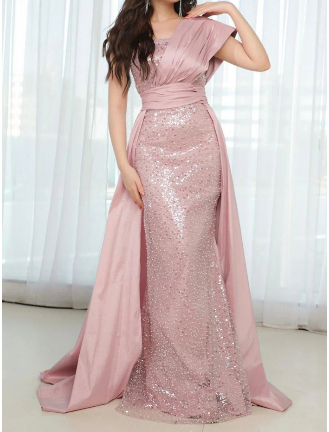 Back view of the formal one-shoulder gown with a sweep train.