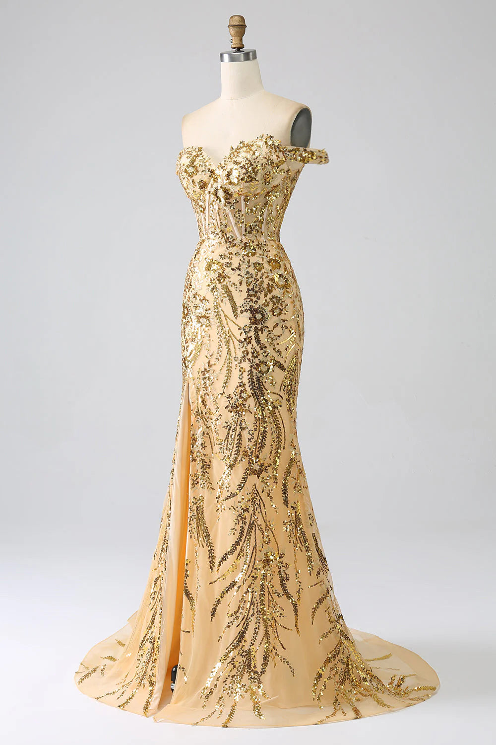 Close-up of the elegant golden mermaid gown with a thigh-high slit.