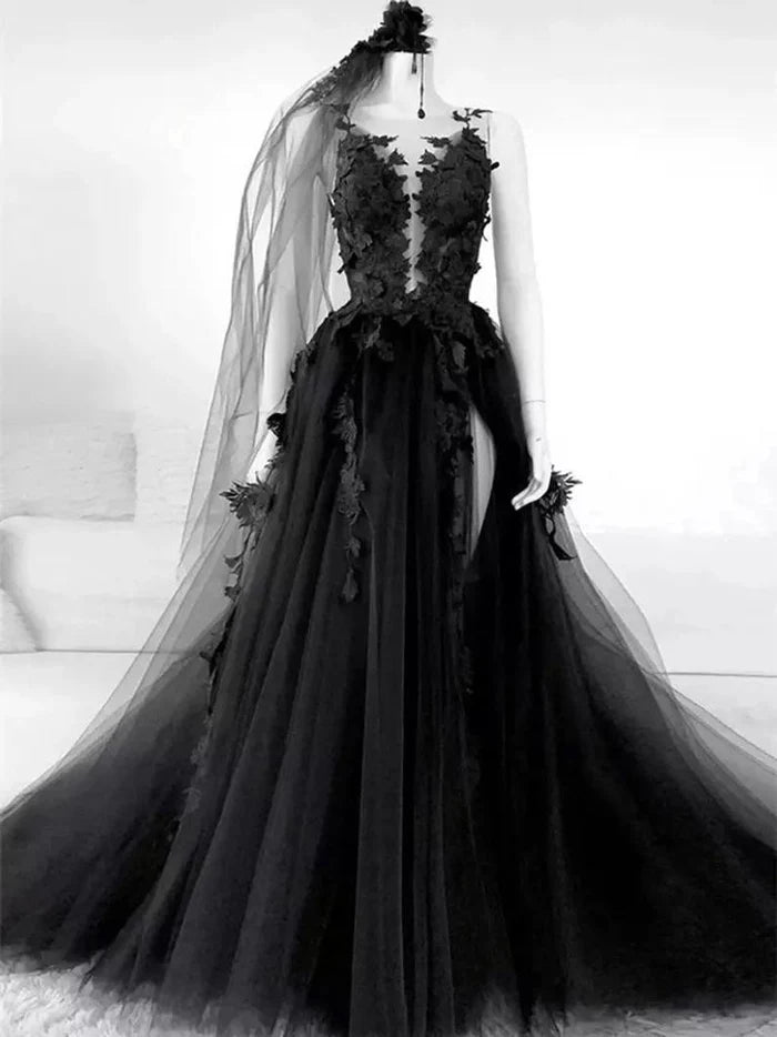 Elegant Gothic lace and tulle backless wedding dress with a long train and veil.
