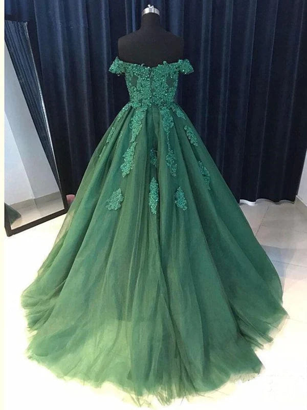 Woman posing in a long off-shoulder beaded lace prom dress.