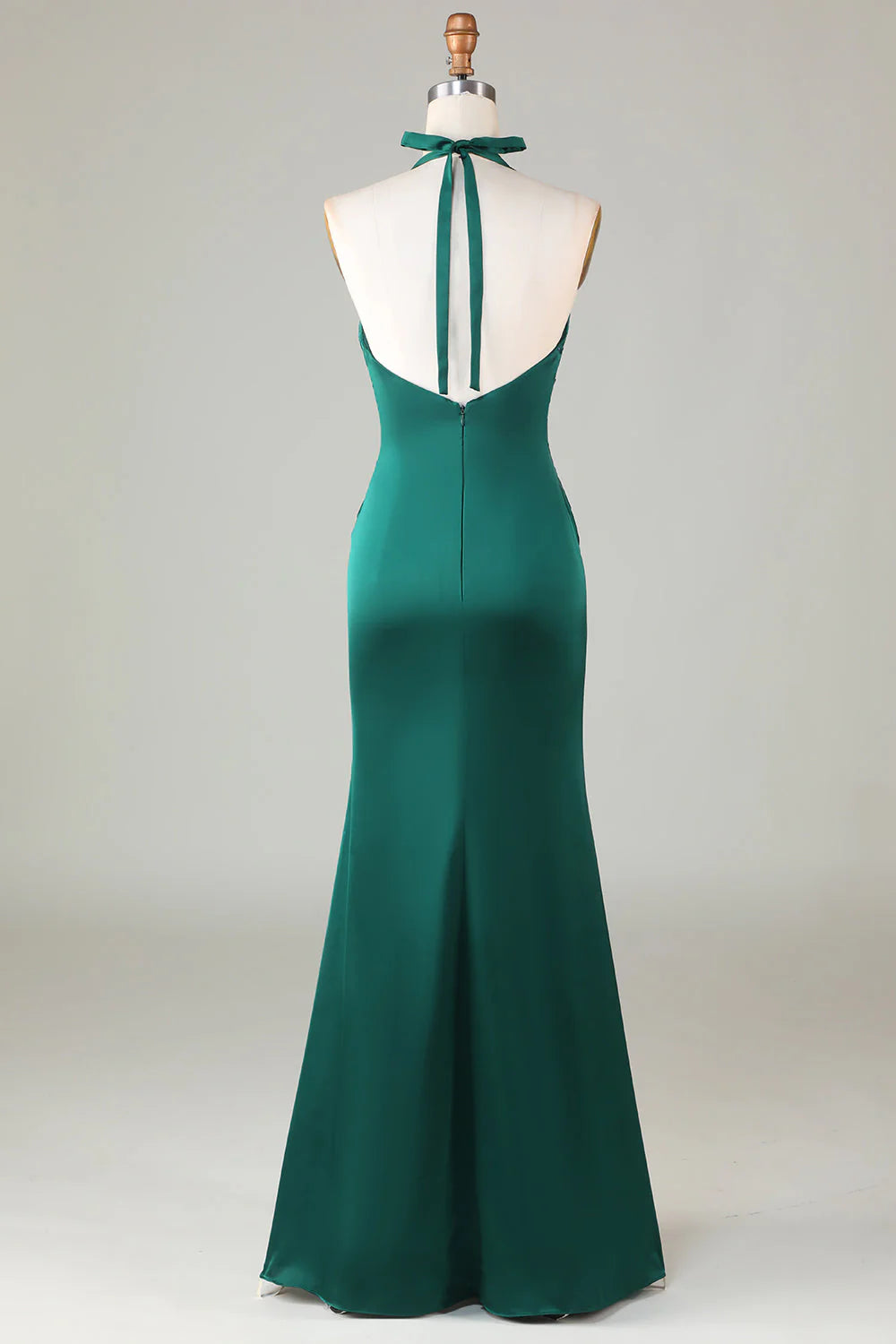 Back view of an elegant green halter gown.