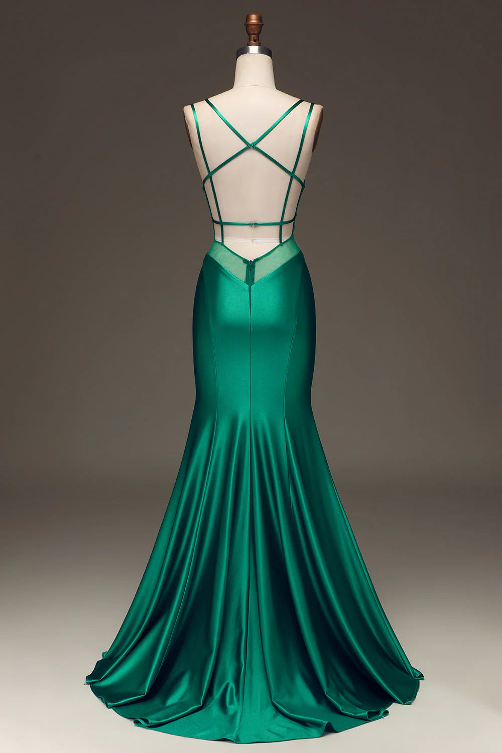 Side view of the green mermaid prom dress, showcasing its flowing silhouette.