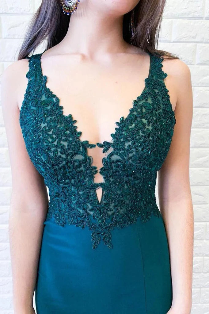 Back view of elegant green satin mermaid gown, highlighting silhouette.