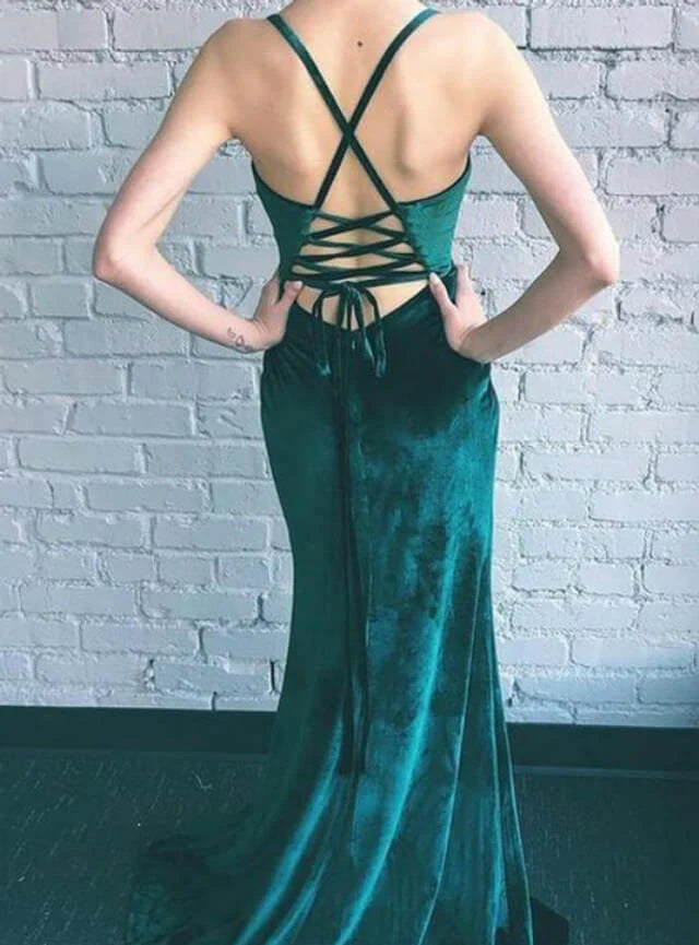Full view of a green velvet mermaid gown, showcasing its luxurious fabric and silhouette.