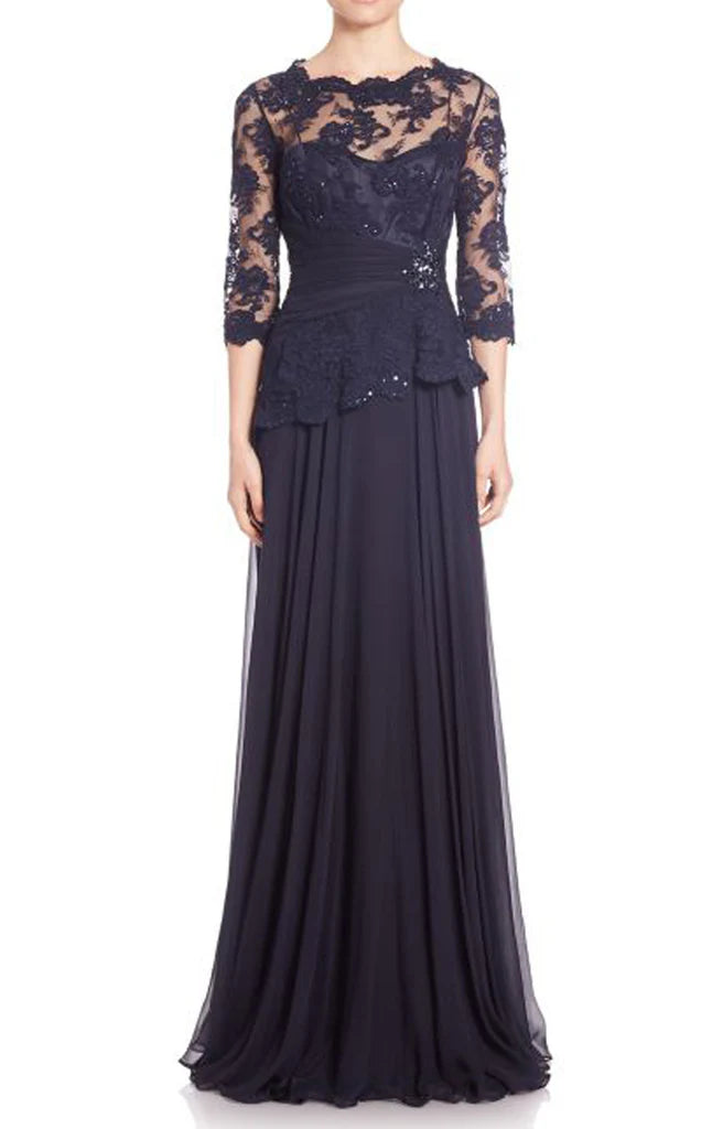 Elegant woman wearing a full-length half sleeve lace chiffon mother of the bride dress.