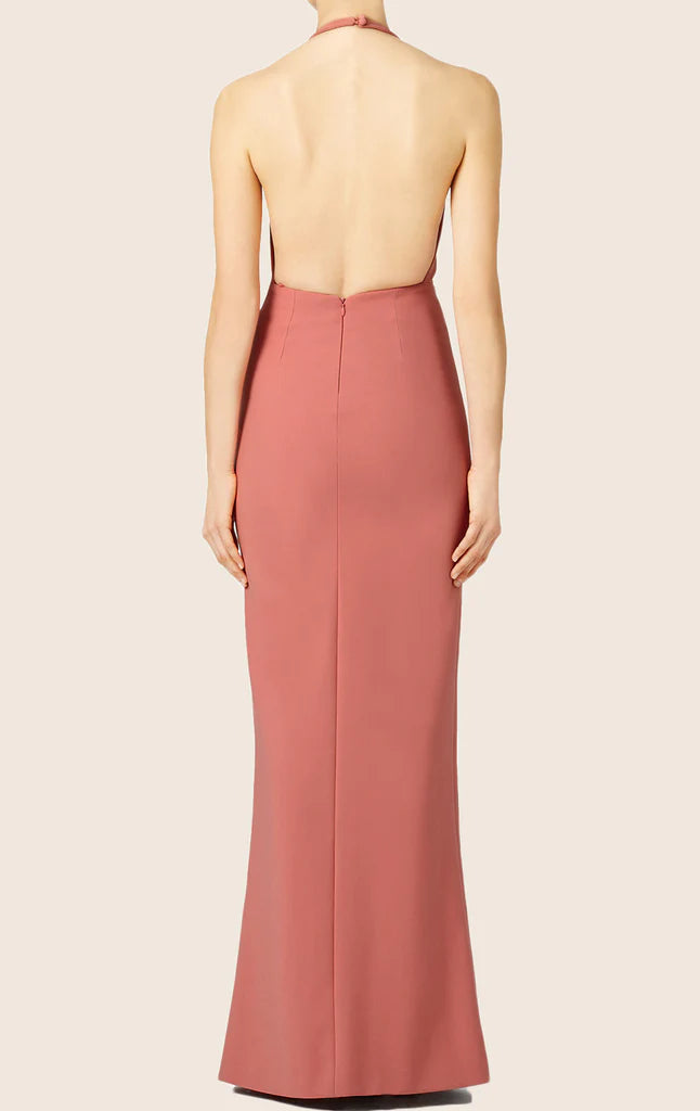 Back view of a woman in a sophisticated halter evening gown.