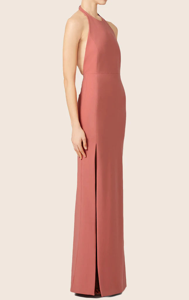 Full length view of a woman in a stylish halter formal dress.