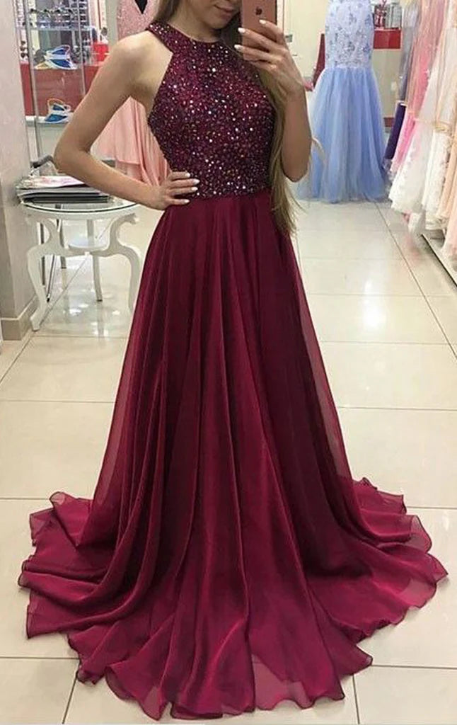 Elegant halter chiffon prom gown with crystal embellishments.