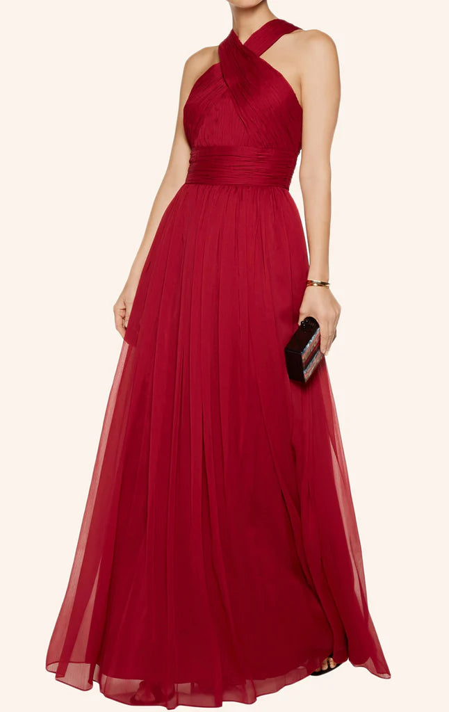 Elegant woman in a light blue halter chiffon long prom dress.