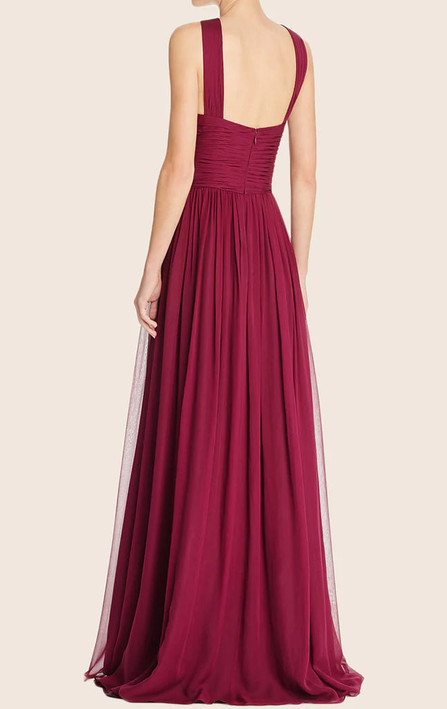 Back view of a flowing halter formal gown.