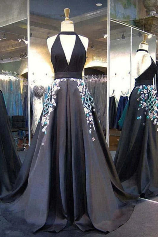 Elegant ankle-length evening gown with halter deep V-neck, backless design, and intricate appliques.