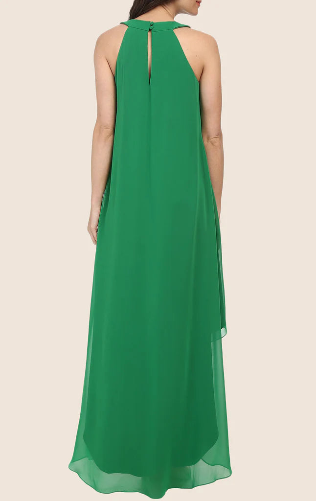 Woman wearing a flowing high-low formal dress with halter neckline.