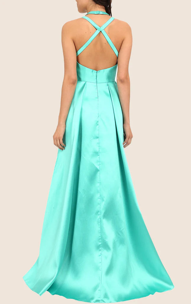 Halter formal gown with high-low hem, side view.